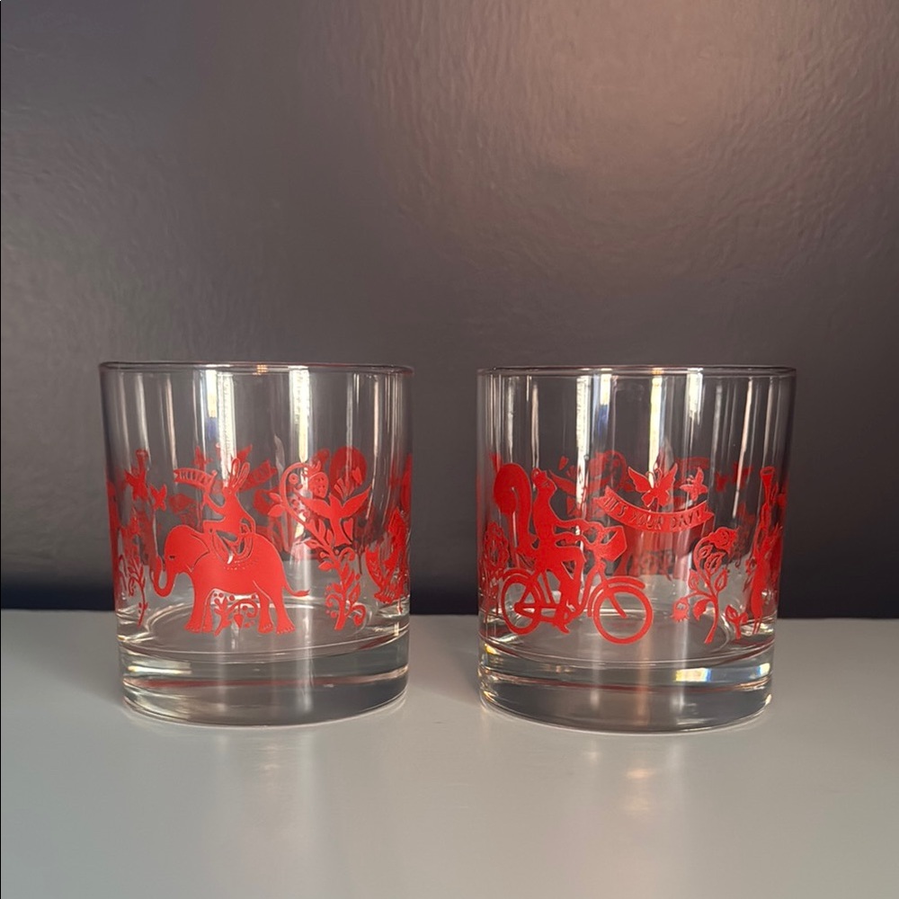 Elegant Glass Tumbler with Red Animal Motif